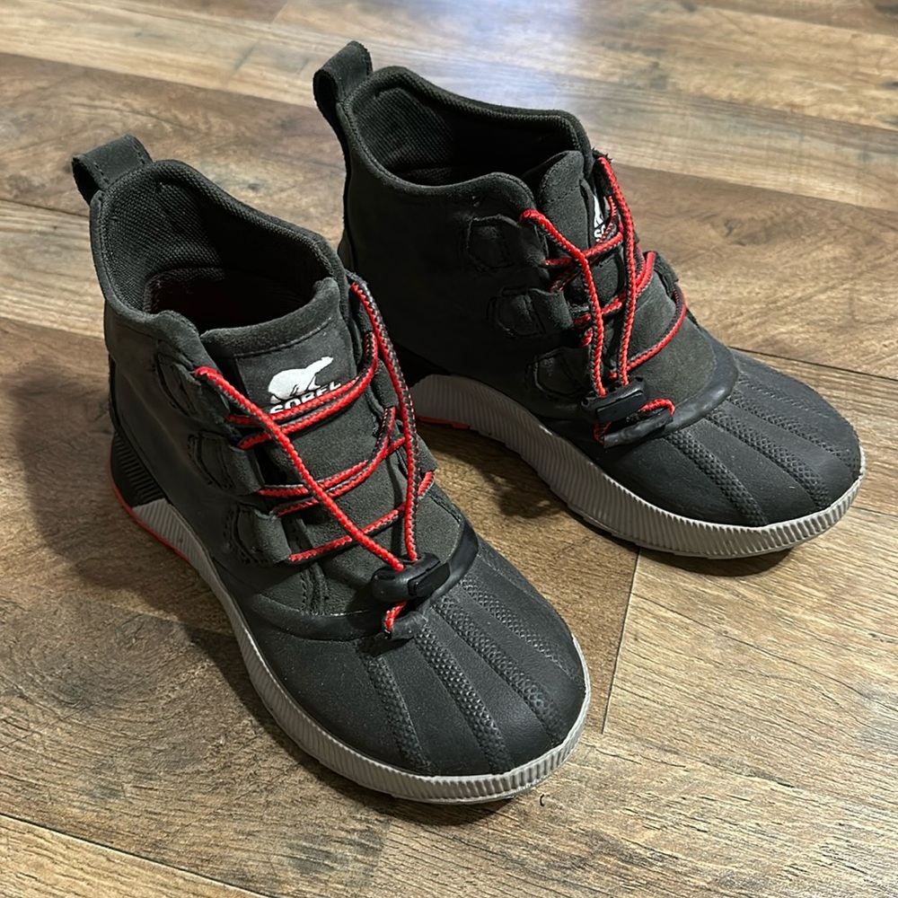 Youth out and about Sorel boots